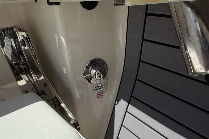 Slide: The Image of 2024 Pathfinder 2700 Open boat detail showing fresh water access and deck design. - 21