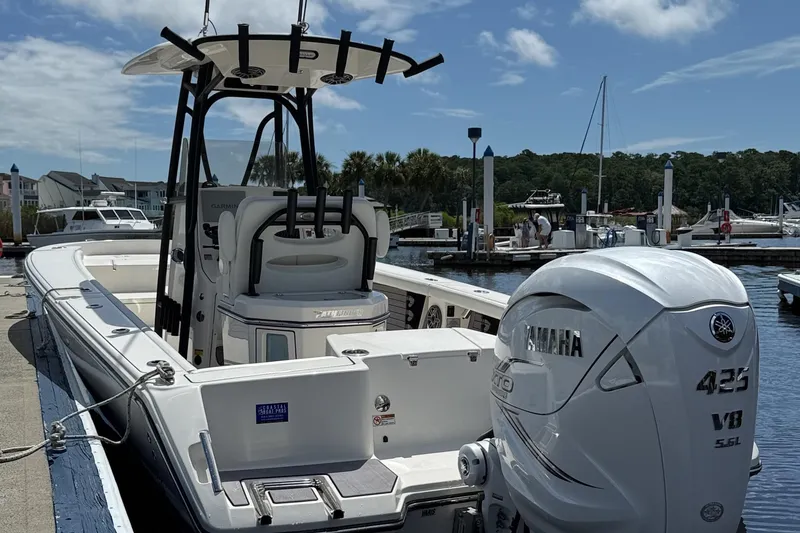 Slide: The Image of 2024 Pathfinder 2700 Open boat with Yamaha 425 V8 engine docked at marina. - 4