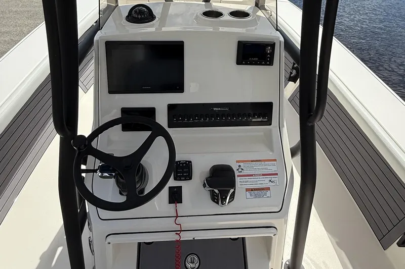 Slide: The Image of 2024 Pathfinder 2700 Open boat console with steering wheel and electronic controls. - 6