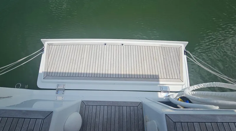 Slide: The Image of Stern view of 2016 Hanse 415 yacht with teak decking and calm water. - 11