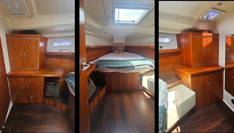 Slide: The Image of Interior of 2016 Hanse 415 yacht cabin with wooden cabinetry and cozy bed. - 23
