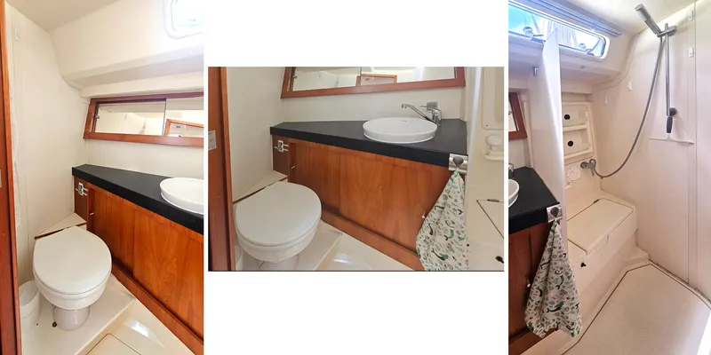 Slide: The Image of 2016 Hanse 415 yacht bathroom with wooden cabinetry, sink, toilet, and shower area. - 24