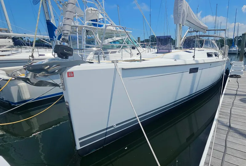 Slide: The Image of 2016 Hanse 415 sailboat docked at marina under clear blue sky. - 3