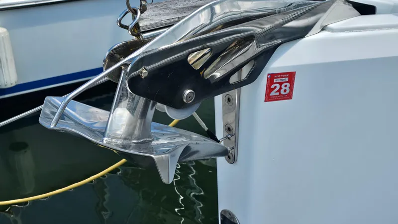 Slide: The Image of Close-up of a 2016 Hanse 415 boat anchor with New York registration sticker. - 33