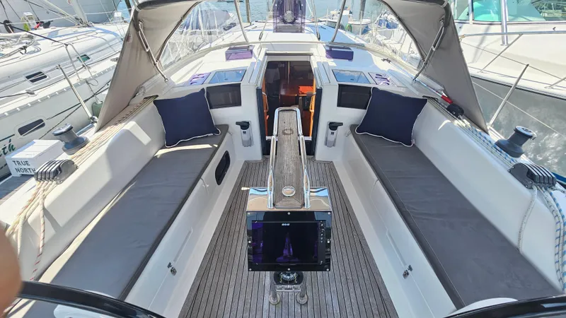 Slide: The Image of 2016 Hanse 415 yacht cockpit with cushioned seating and navigation equipment. - 35