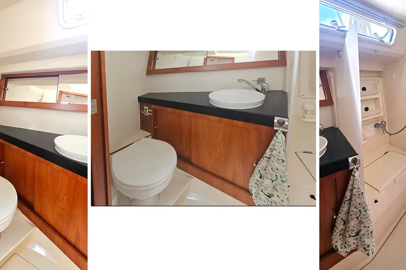 Slide: The Image of 2016 Hanse 415 yacht bathroom with wooden cabinetry, sink, and toilet. - 34