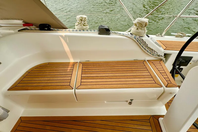 Slide: The Image of Teak deck seating on 2016 Hanse 415 sailboat, featuring elegant wood finish. - 8