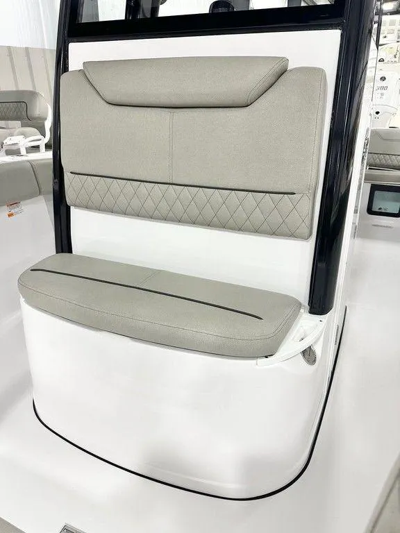 Slide: The Image of 2025 Sportsman Heritage 231 boat seat with cushioned backrest and sleek design. - 11