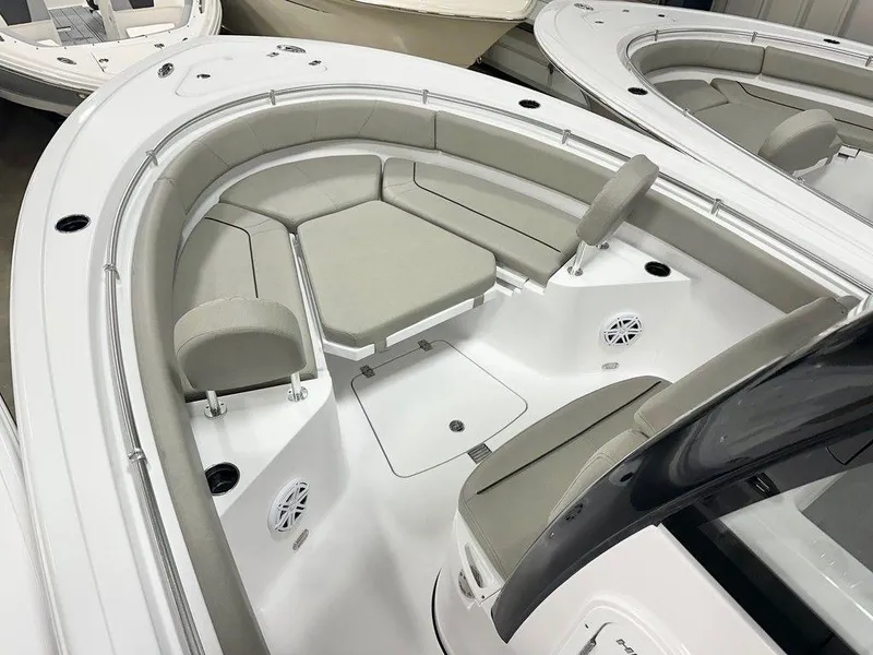 Slide: The Image of 2025 Sportsman Heritage 231 boat interior with cushioned seating and modern design. - 4