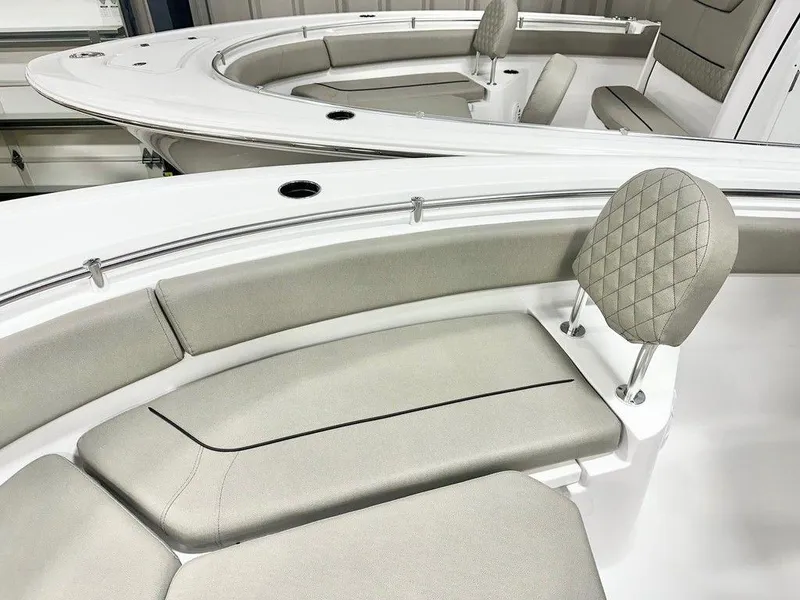 Slide: The Image of 2025 Sportsman Heritage 231 boat interior with cushioned seating and modern design. - 8
