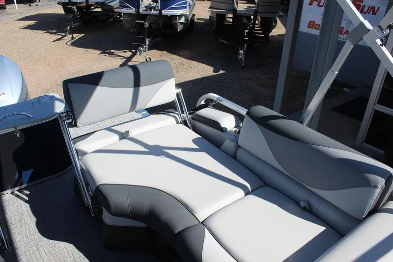 Slide: The Image of 2025 Avalon LSZ Quad Lounger Shift 21 FT boat interior with gray seating. - 14