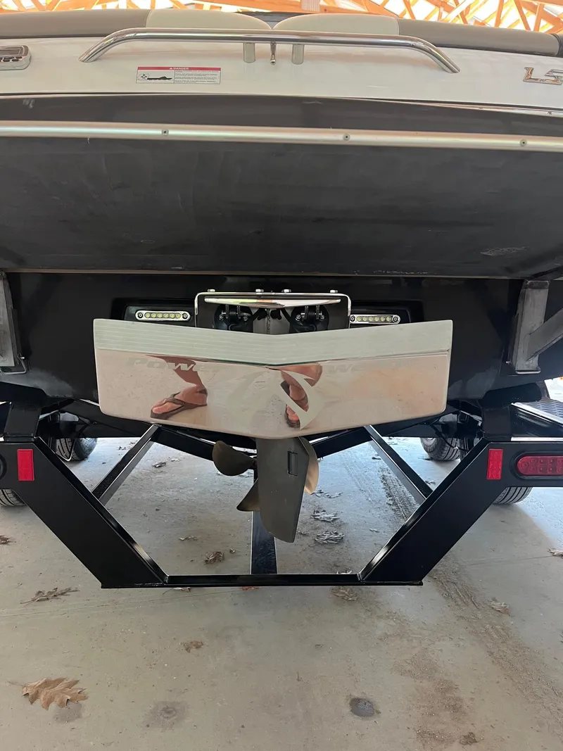 Slide: The Image of 2008 Malibu Sunscape 21 LSV boat on trailer, rear view showing propeller and swim platform. - 9