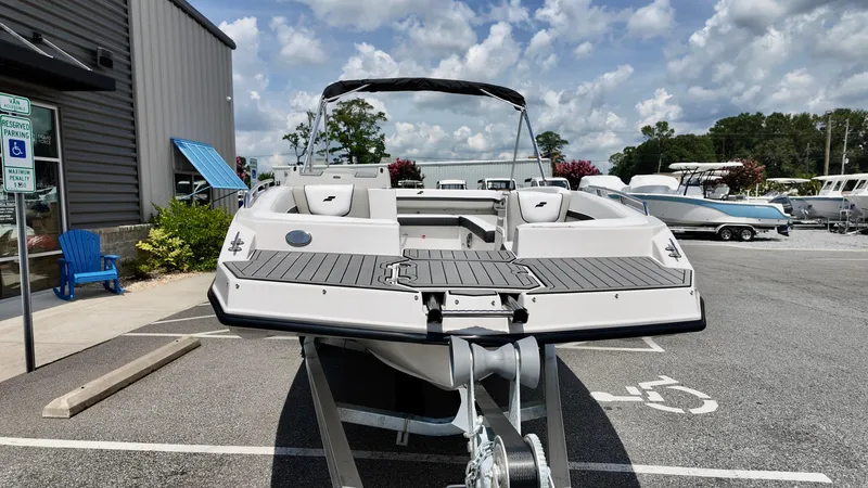 Slide: The Image of 2026 Starcraft SVX 191 OB boat displayed outdoors, showcasing sleek design and modern features. - 4