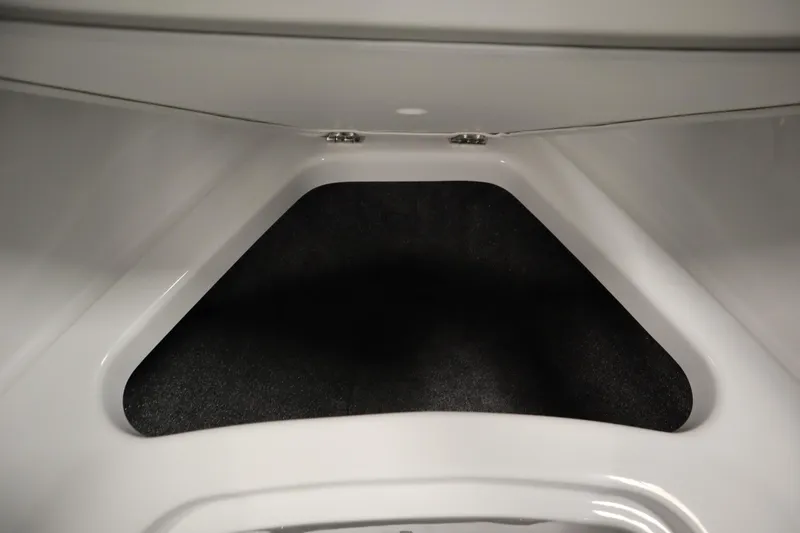 Slide: The Image of 2025 Four Winns H1 Freedom boat storage compartment, featuring sleek white interior design. - 13