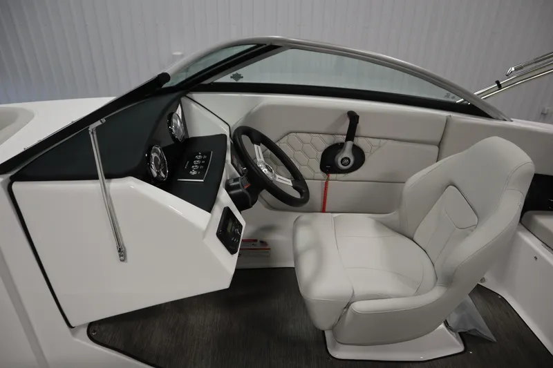 Slide: The Image of 2025 Four Winns H1 Freedom boat interior with modern dashboard and comfortable seating. - 18