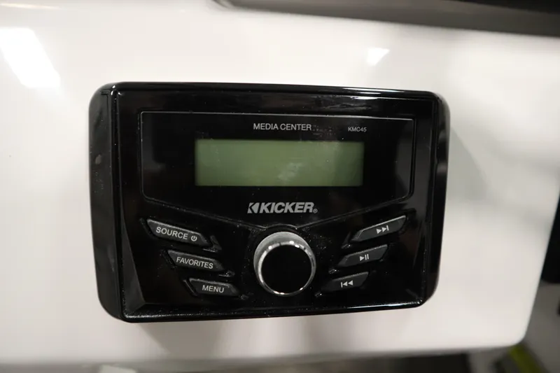 Slide: The Image of Kicker media center in 2025 Four Winns H1 Freedom boat. - 23