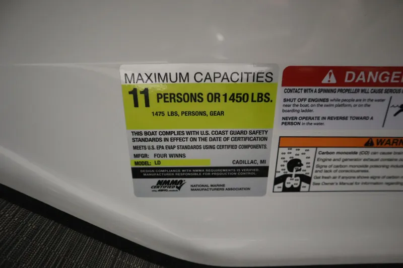 Slide: The Image of 2025 Four Winns H1 Freedom capacity label: 11 persons or 1450 lbs, safety compliance details. - 25