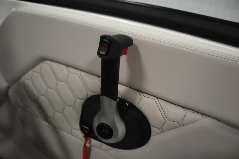 Slide: The Image of 2025 Four Winns H1 Freedom throttle control on quilted interior panel. - 26