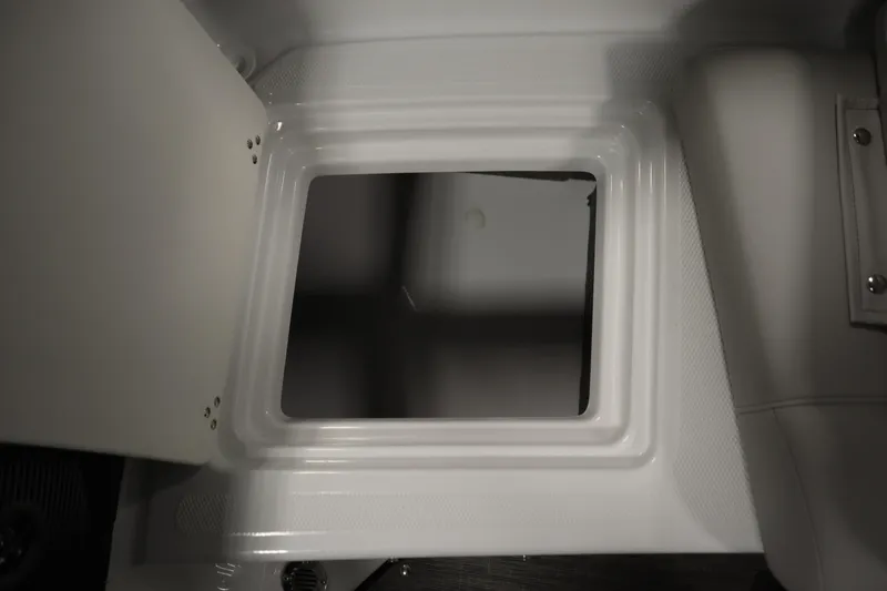 Slide: The Image of 2025 Four Winns H1 Freedom storage compartment with open hatch, showcasing interior space. - 41