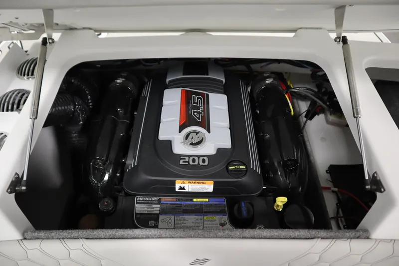 Slide: The Image of 2025 Four Winns H1 Freedom engine compartment with Mercury 4.5L 200 horsepower engine. - 43
