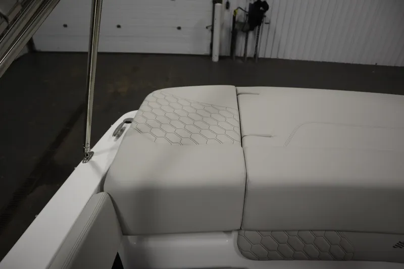 Slide: The Image of 2025 Four Winns H1 Freedom boat interior with hexagonal pattern upholstery. - 45