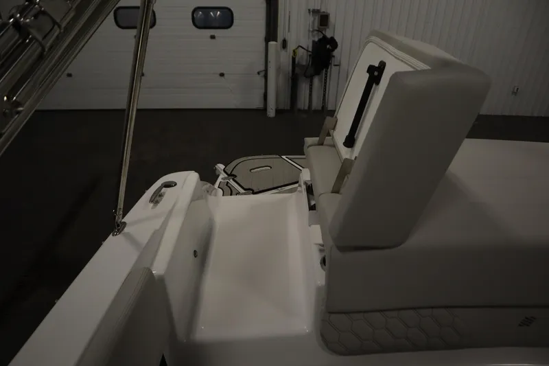 Slide: The Image of 2025 Four Winns H1 Freedom boat interior with white seating and sleek design. - 46