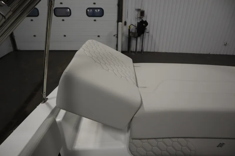 Slide: The Image of 2025 Four Winns H1 Freedom boat interior with white cushioned seating. - 47