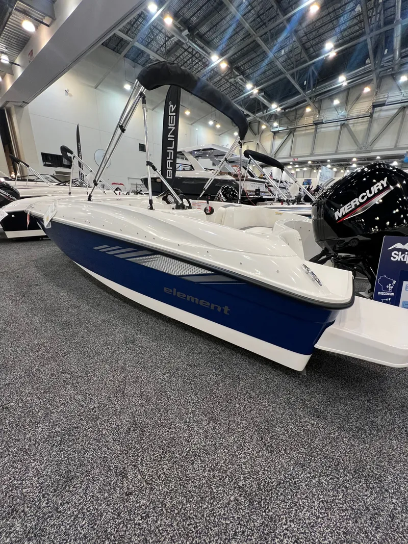 The Image of 2026 Bayliner E16LE boat displayed at a trade show. - 0