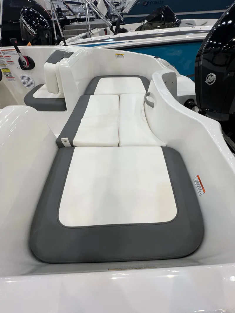 Slide: The Image of Interior of 2026 Bayliner E16LE with gray and white seating. - 2