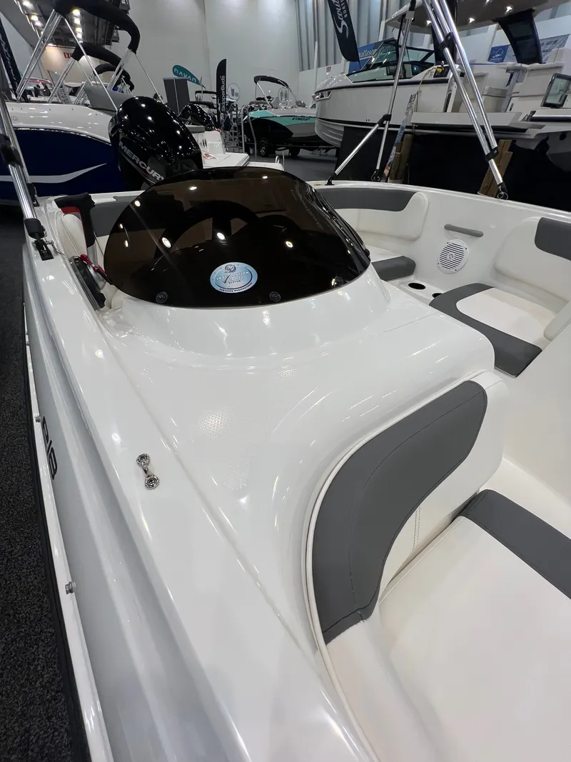 Slide: The Image of Bayliner E16LE 2026 displayed at a boat show. - 8
