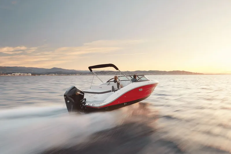 Slide: The Image of 2026 Sea Ray SPX 210 Outboard displayed at a boat show. - 3