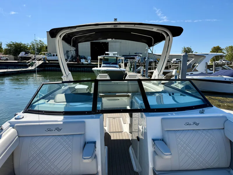 Slide: The Image of The image shows a 2026 Sea Ray SDX 290 boat with sleek seating and a modern design. - 13