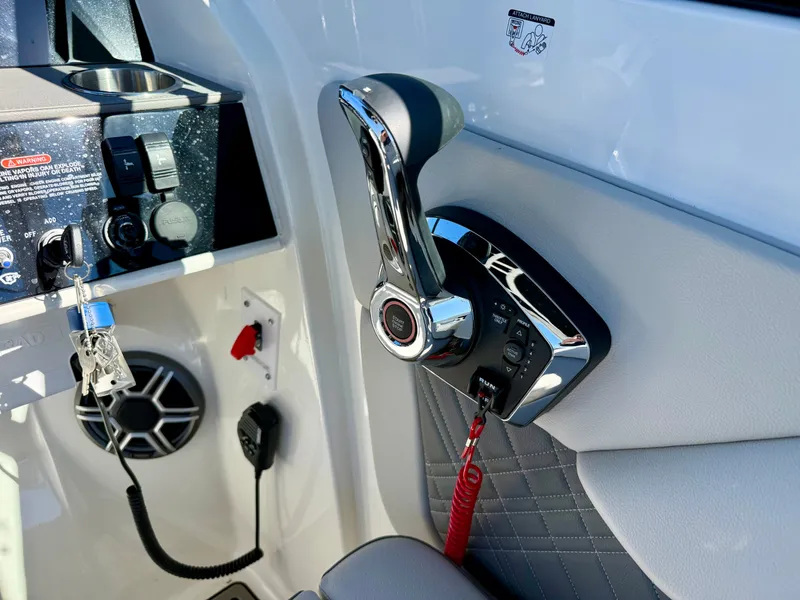 Slide: The Image of Close-up of a Sea Ray SDX 290 helm with modern controls and upholstery. - 10