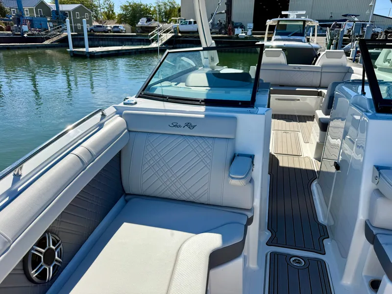 Slide: The Image of The image shows the interior of a 2026 Sea Ray SDX 290 boat with elegant seating. - 14