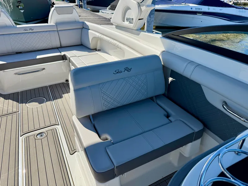 Slide: The Image of The image shows the cockpit of a Sea Ray SDX 290 boat with sleek gray upholstery. - 8