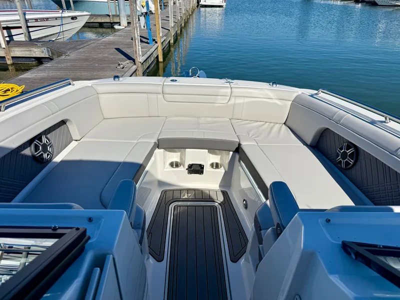 Slide: The Image of The image shows the spacious cockpit of a Sea Ray SDX 290 docked at a pier. - 15