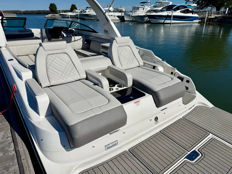 Slide: The Image of The image shows a 2026 Sea Ray SDX 290 boat with luxurious seating at the stern. - 3