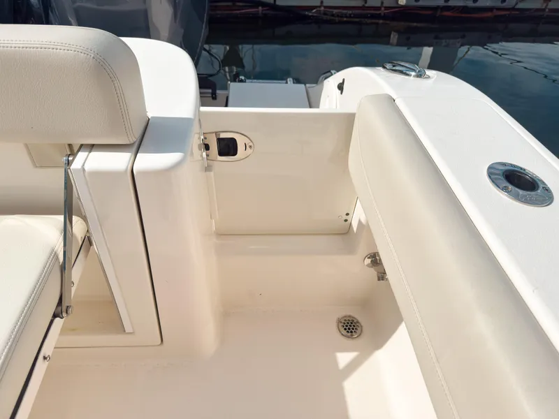 Slide: The Image of 2023 Cobia 280 Center Console boat interior with seating and deck details. - 11