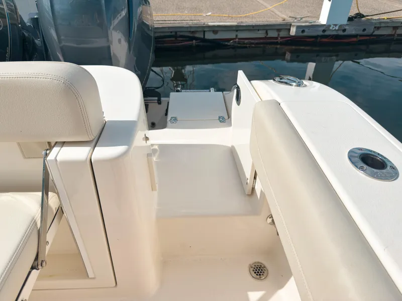 Slide: The Image of 2023 Cobia 280 Center Console boat interior with seating and deck details. - 12