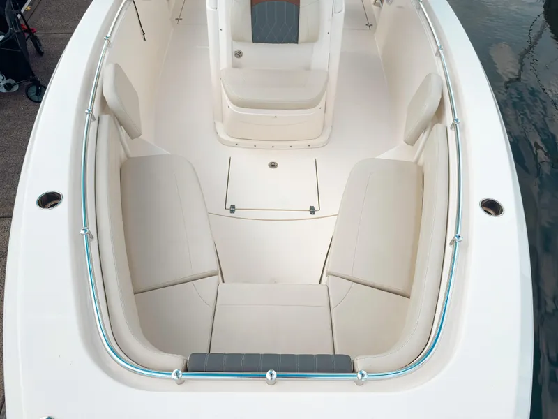 Slide: The Image of 2023 Cobia 280 Center Console boat interior with cushioned seating and sleek design. - 33