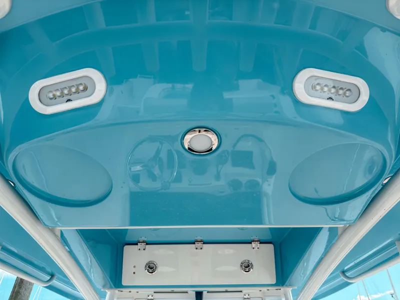 Slide: The Image of 2023 Cobia 280 Center Console boat's blue interior ceiling with LED lights. - 39