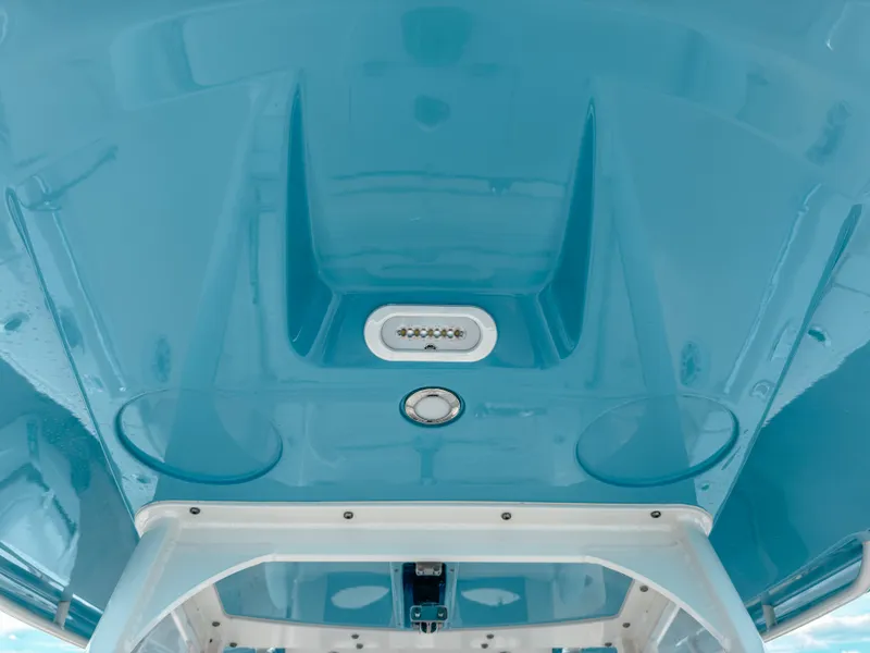 Slide: The Image of 2023 Cobia 280 Center Console boat's blue interior ceiling with LED lights. - 41