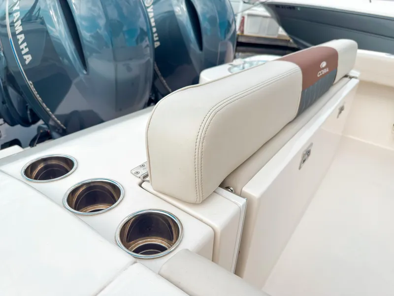 Slide: The Image of 2023 Cobia 280 Center Console boat with Yamaha engines and cup holders. - 8