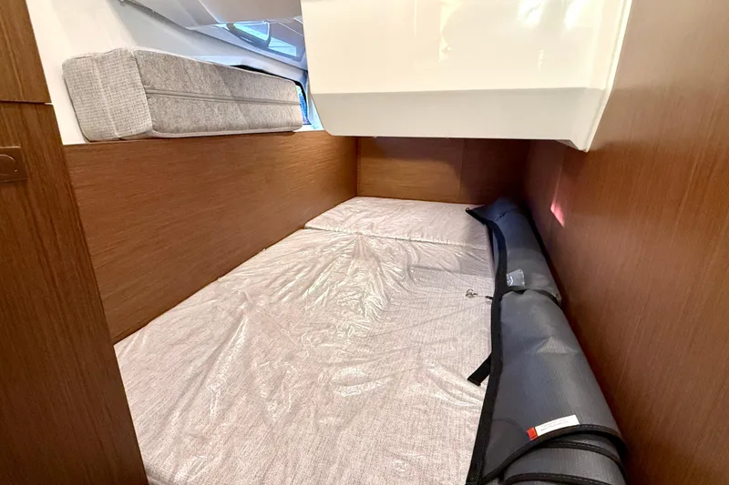 Slide: The Image of 2024 Jeanneau NC 1095 cabin interior with cozy bed and modern design. - 42