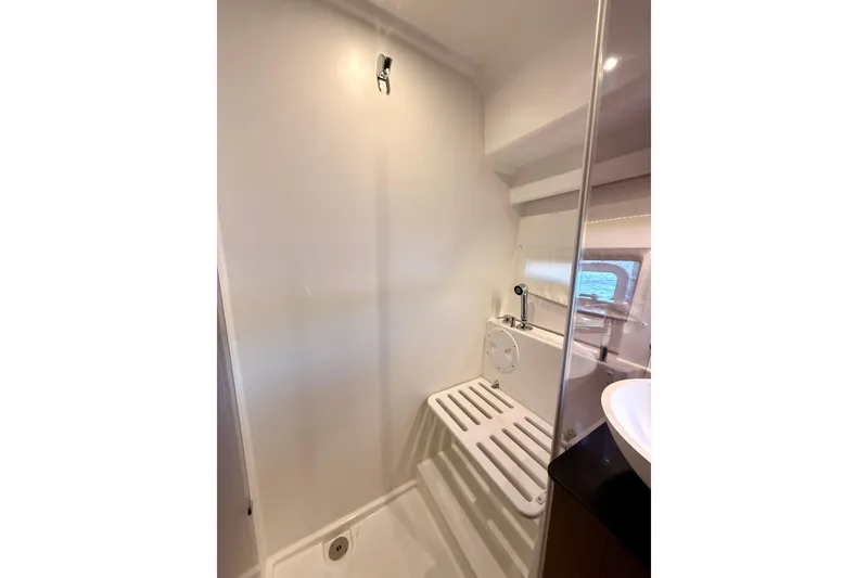 Slide: The Image of 2024 Jeanneau NC 1095 bathroom with modern shower and sleek design. - 45