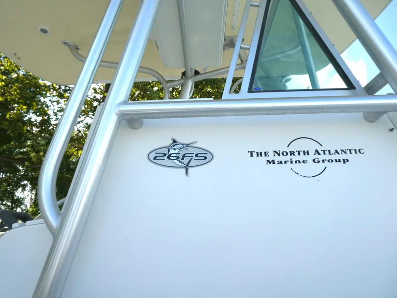 Slide: The Image of 2004 Regulator 26 Forward Seating boat with North Atlantic Marine Group logo. - 12