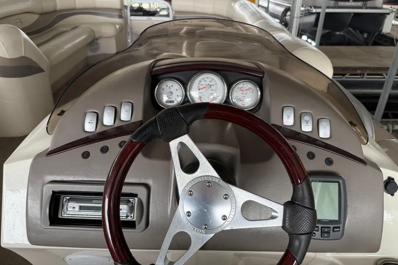 Slide: The Image of Steering console of a 2006 Bennington 2575RL I/O boat with gauges and controls. - 5