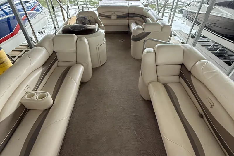 Slide: The Image of Luxurious interior of a 2006 Bennington 2575RL I/O pontoon boat with plush seating. - 8