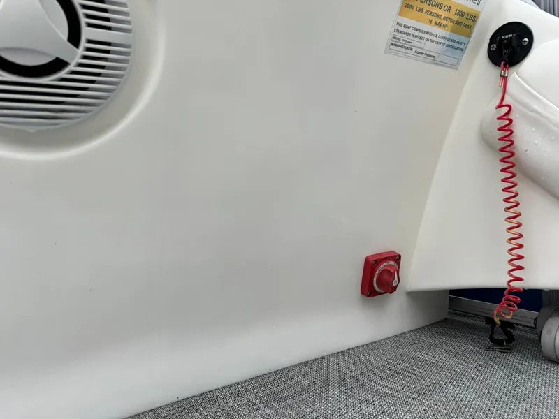 Slide: The Image of 2023 Frontier 24' Cruiser interior with safety features and control panel. - 21