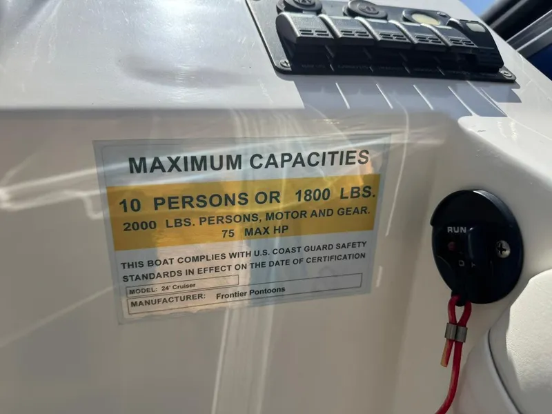 Slide: The Image of 2023 Frontier 24' Cruiser capacity label, 10 persons or 1800 lbs, 75 max HP. - 22